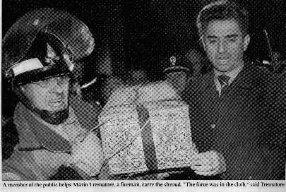 Picture of fireman Mario Trematore rescuing the shroud